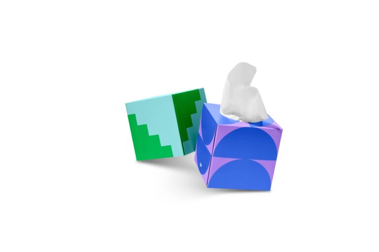 Two decorative tissue boxes, one with blue and purple half-circles, the other with green and light blue steps.