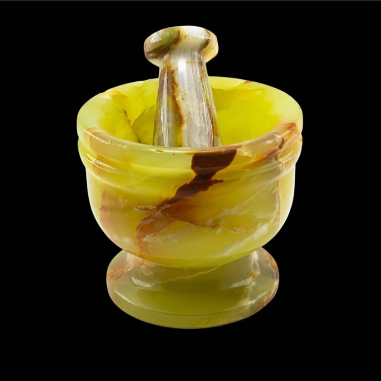 Yellow onyx mortar and pestle with brown and white veining.